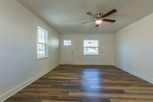 interior space featuring ceiling fan and dark hardwood / wood-style floors