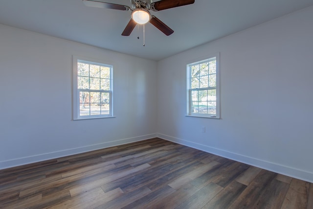 spare room featuring dark hardwood / wood-style floors and ceiling fan