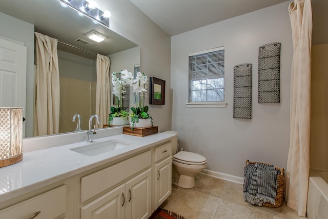 full bathroom with vanity, tile patterned floors, toilet, and shower / tub combo with curtain