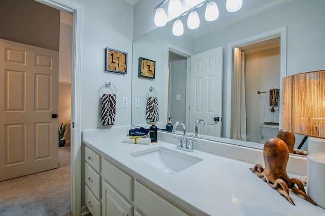 bathroom featuring vanity and ornamental molding