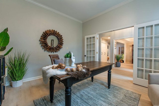 office area with crown molding, french doors, and light wood-type flooring