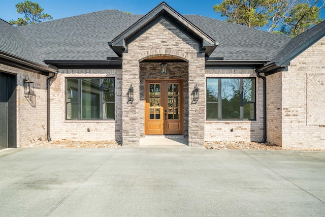 doorway to property featuring french doors