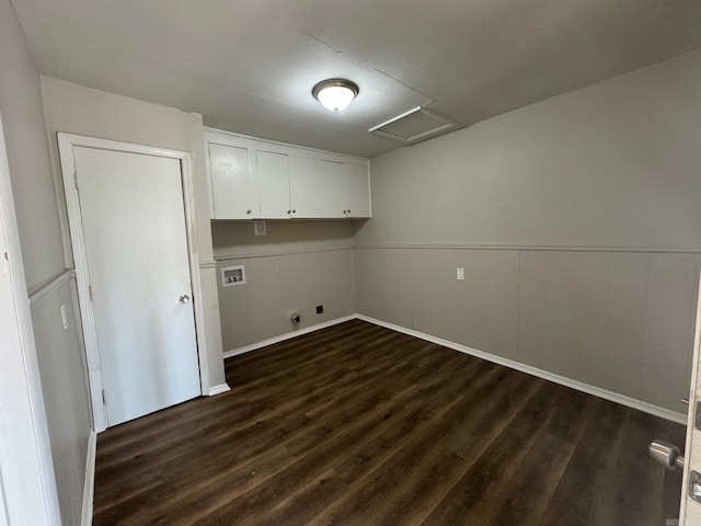 laundry area featuring dark wood-type flooring, gas dryer hookup, cabinets, hookup for a washing machine, and electric dryer hookup