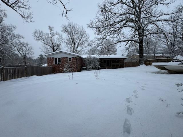 view of yard layered in snow