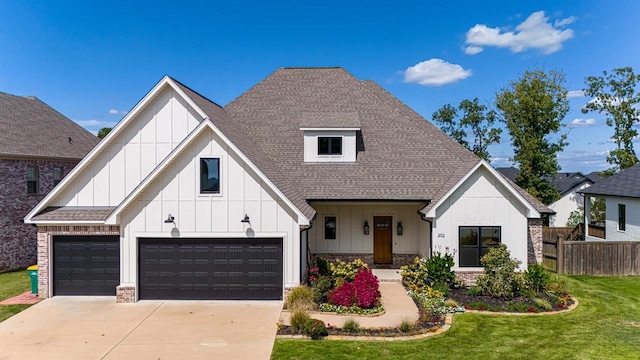 modern inspired farmhouse featuring a garage and a front lawn