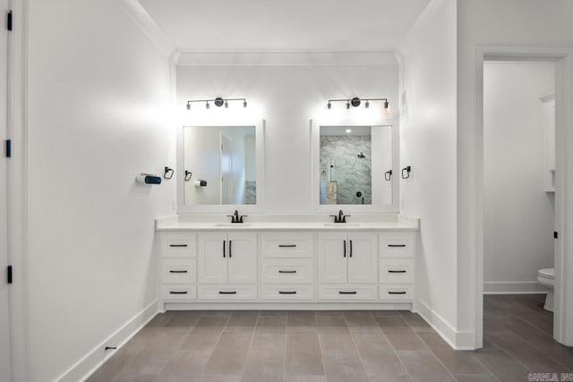 bathroom featuring vanity, an enclosed shower, crown molding, and toilet