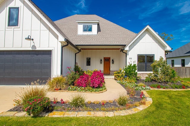 modern farmhouse style home featuring a front yard