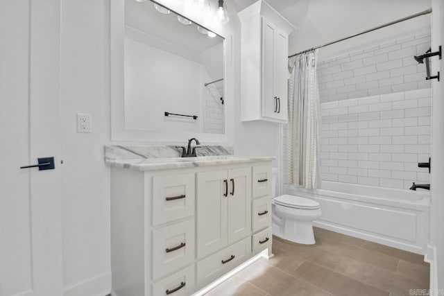 full bathroom with vanity, shower / tub combo with curtain, and toilet