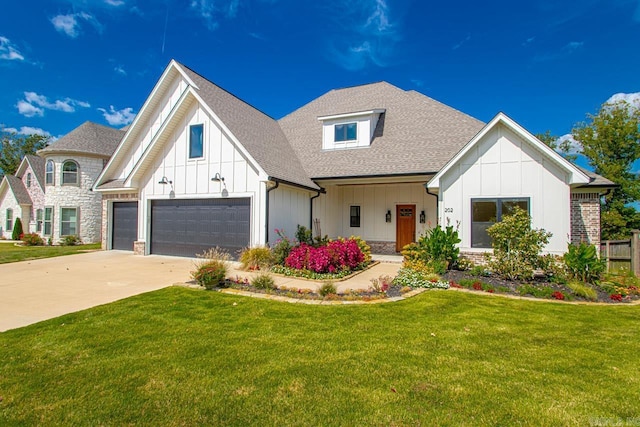 modern farmhouse style home featuring a garage and a front lawn