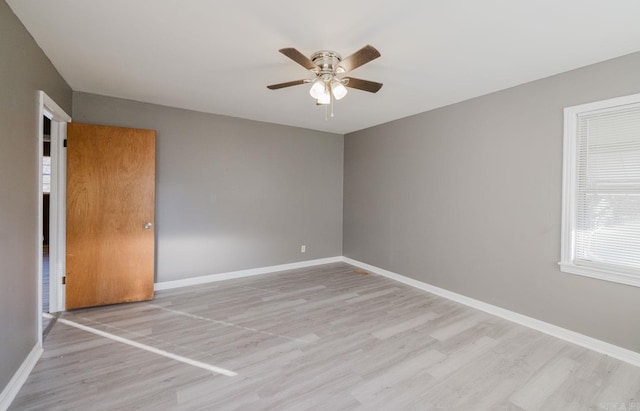 unfurnished room featuring ceiling fan and light wood-type flooring