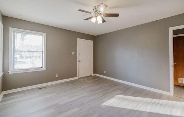 unfurnished room featuring ceiling fan and light wood-type flooring