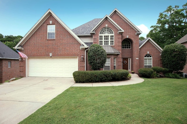 front of property featuring a garage and a front lawn