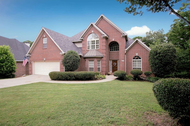 front of property with a garage and a front yard