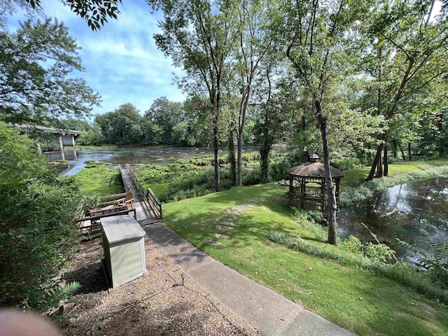 view of yard with a water view and a gazebo