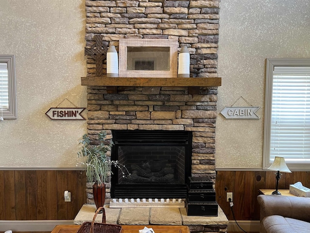 details featuring wooden walls and a fireplace