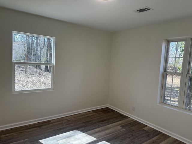 unfurnished room featuring dark hardwood / wood-style floors