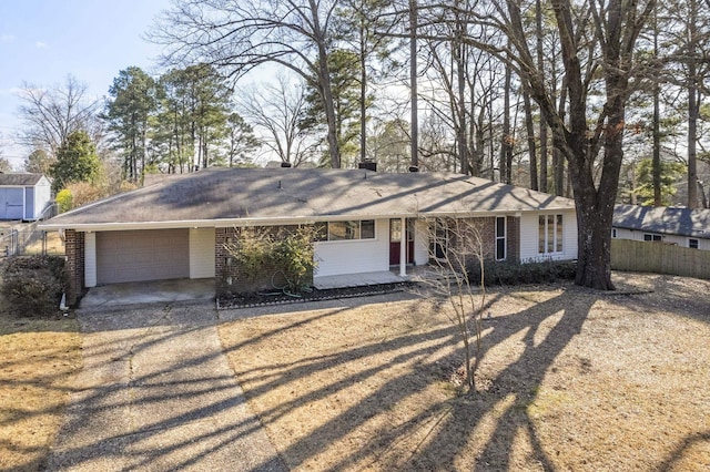 ranch-style home featuring a garage