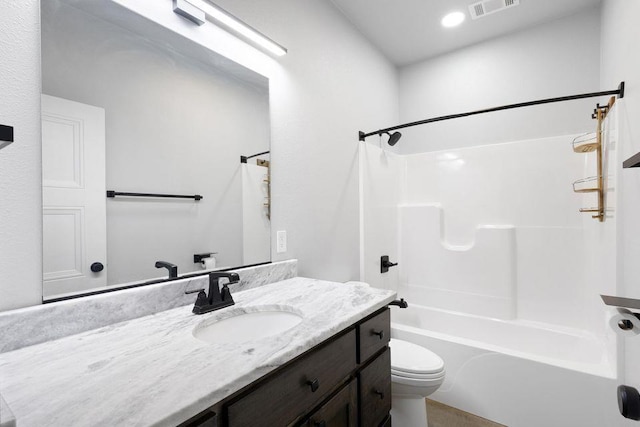 full bathroom with vanity, bathing tub / shower combination, and toilet