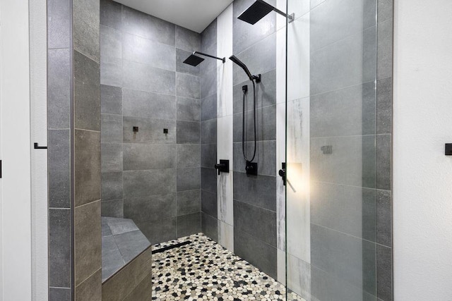 bathroom with a tile shower