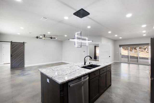 kitchen with sink, hanging light fixtures, a center island with sink, stainless steel dishwasher, and a barn door