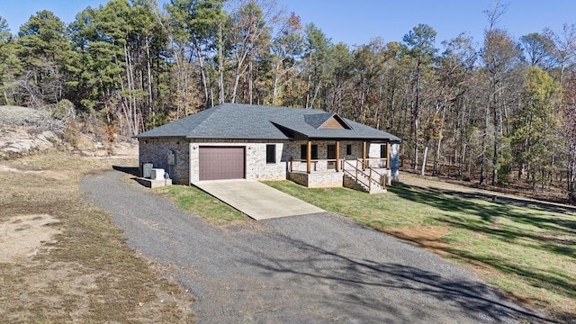 view of front facade with a garage and covered porch
