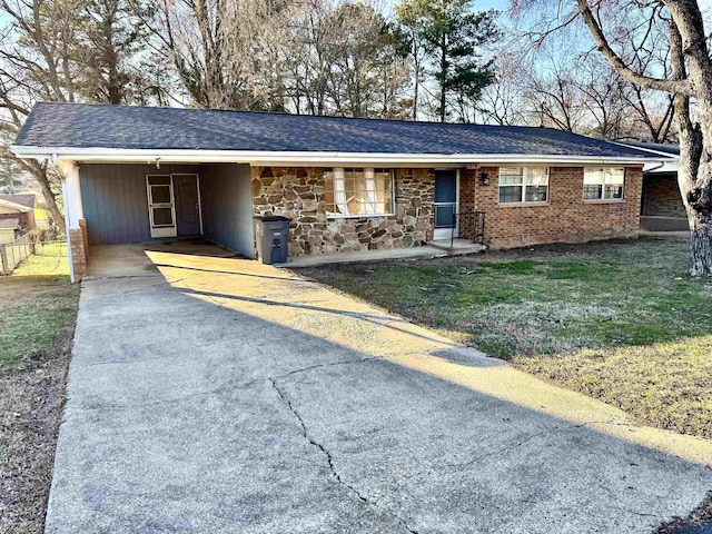 ranch-style home with a front lawn and a carport