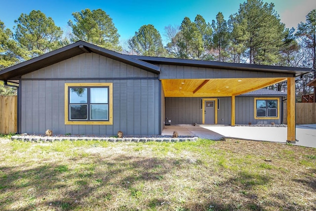 view of front of property with a front lawn and a patio area