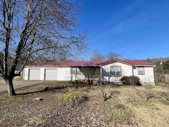 view of front facade with covered porch and a garage