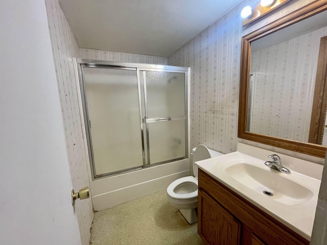 full bathroom with vanity, toilet, and enclosed tub / shower combo