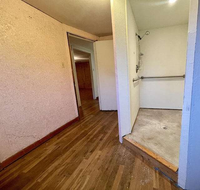 hallway featuring dark wood-type flooring