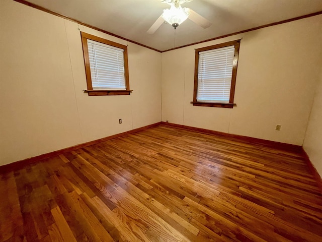 unfurnished room featuring ceiling fan, hardwood / wood-style flooring, and crown molding