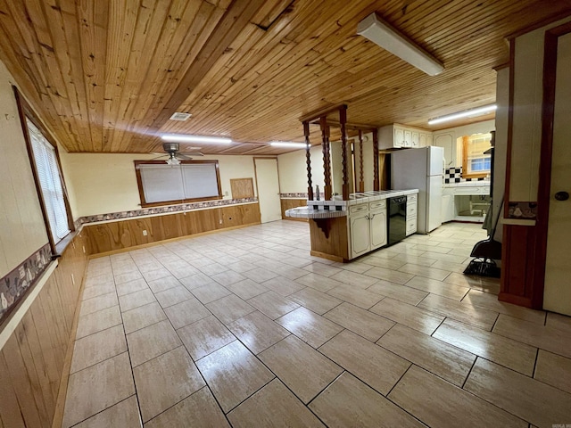 kitchen with wood ceiling, kitchen peninsula, white fridge, and dishwasher