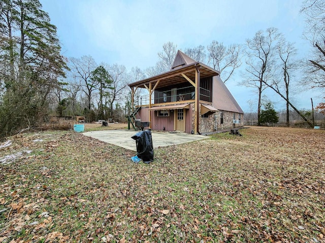 868 River Bend Cv, El Dorado, AR 71730 - back of property with a patio area