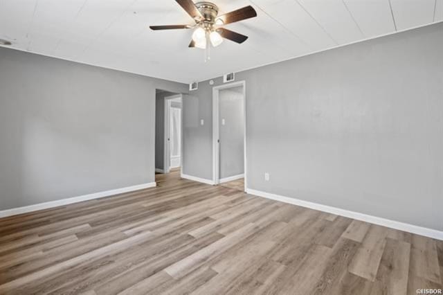 spare room with ceiling fan and light hardwood / wood-style floors