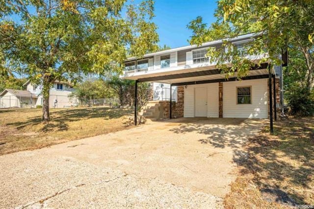 view of front of home featuring a carport