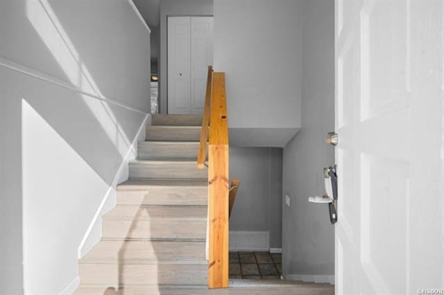 stairs with wood-type flooring