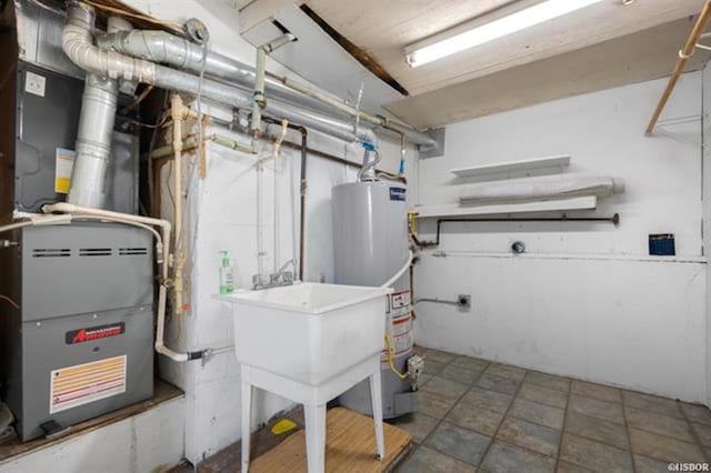 utility room featuring gas water heater