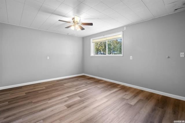 unfurnished room featuring hardwood / wood-style flooring and ceiling fan