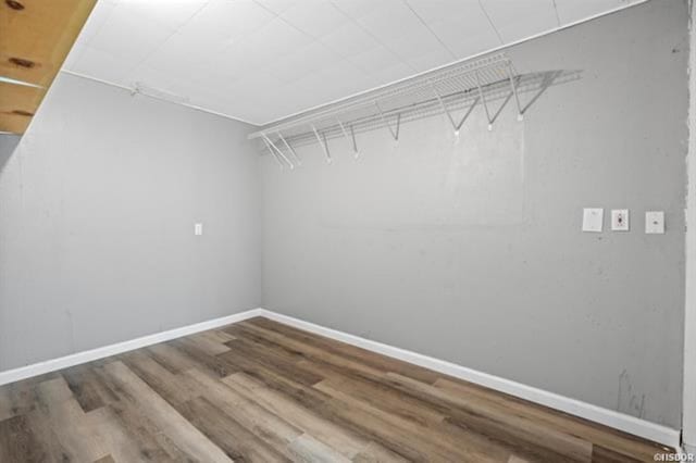 walk in closet featuring hardwood / wood-style floors