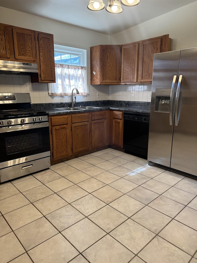 kitchen featuring light tile patterned floors, sink, stainless steel appliances, and tasteful backsplash