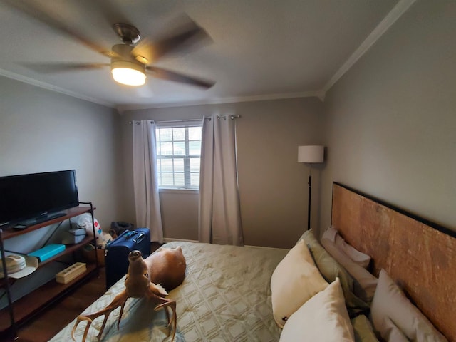 bedroom featuring ornamental molding, ceiling fan, and dark colored carpet