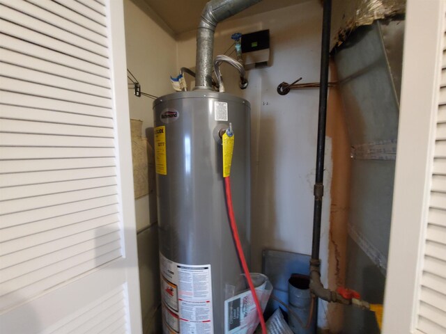 utility room with water heater