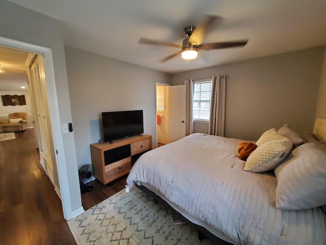 bedroom with dark wood-type flooring and ceiling fan