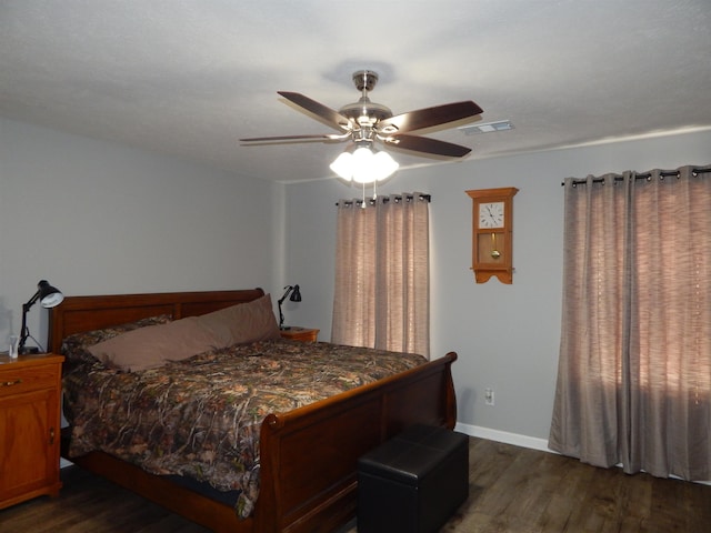 bedroom featuring dark hardwood / wood-style floors and ceiling fan