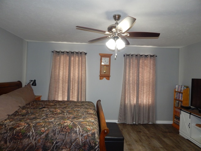 bedroom featuring dark hardwood / wood-style floors and ceiling fan