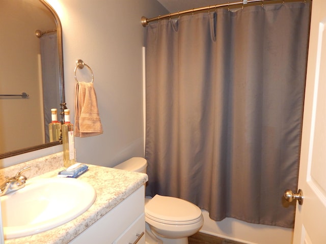 bathroom with vanity, toilet, and walk in shower
