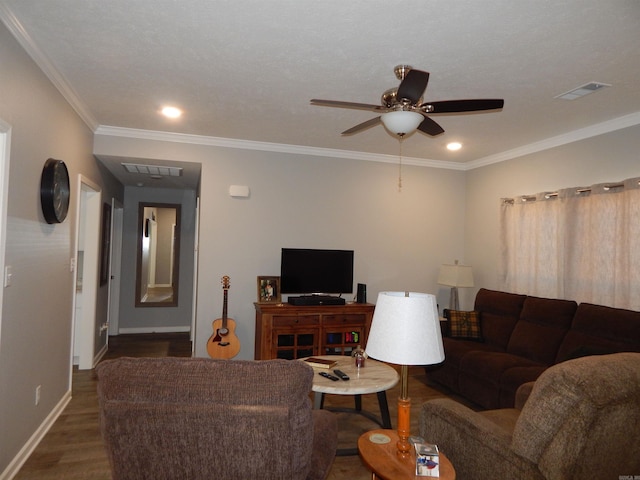 living room featuring crown molding, ceiling fan, and dark hardwood / wood-style flooring