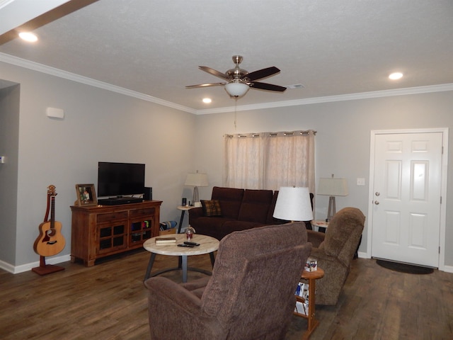 living room with crown molding, dark hardwood / wood-style floors, and ceiling fan