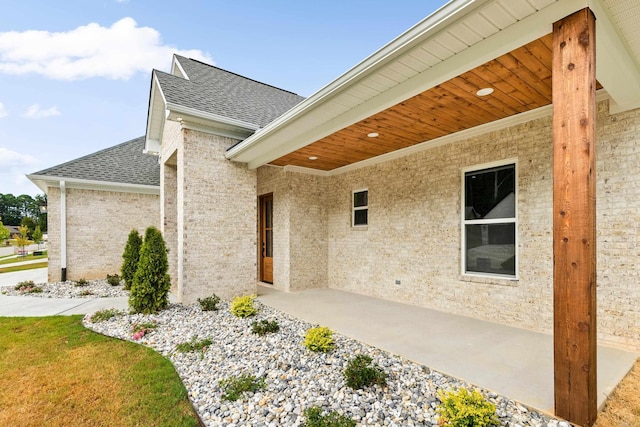 property entrance featuring a patio area