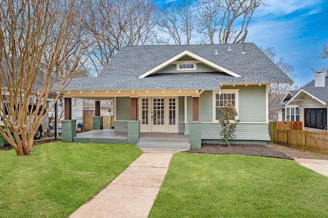 bungalow-style house with a front yard